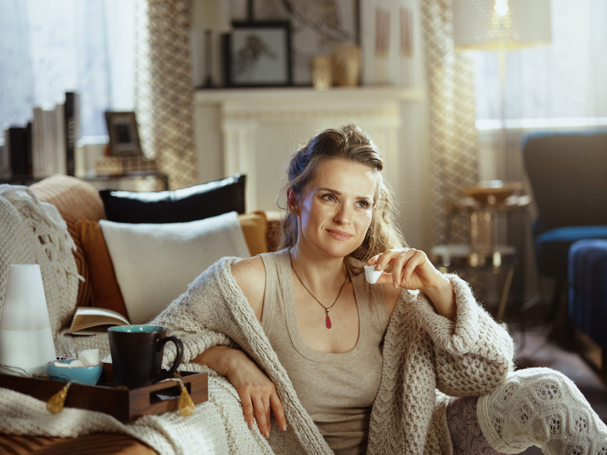 A casually dressed woman relaxing in the comfort of her living room.